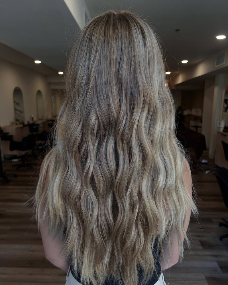 Bright dimensional foiled blonde by Auburn CA hairstylist Kayla MacArthur — Emily's two-session blonde comeback.
