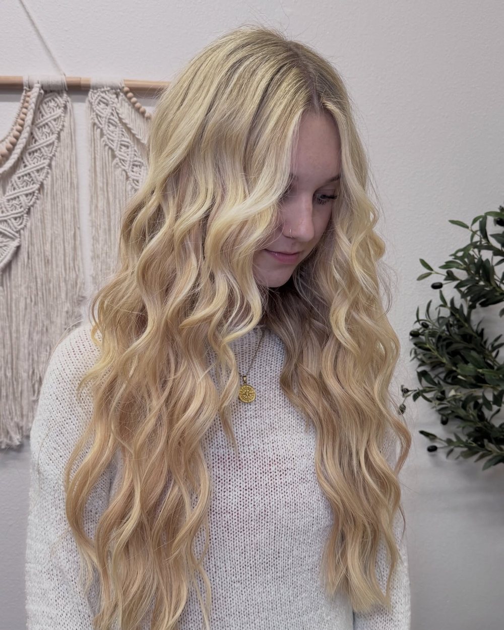 Bouncy blonde curls with a soft face-frame, freshly styled in Kayla's Auburn CA studio.
