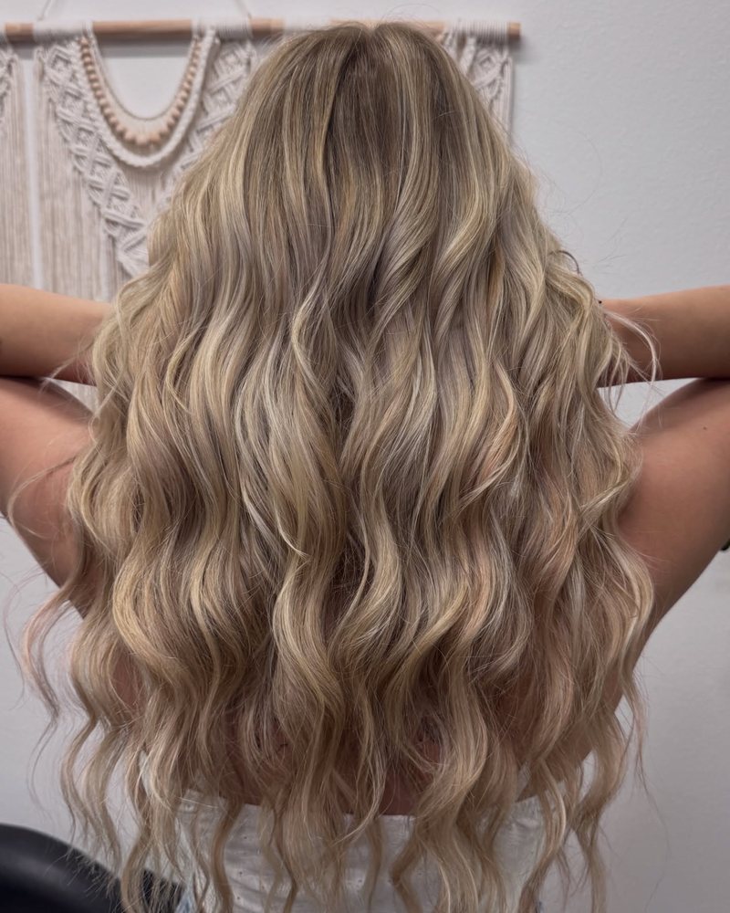 Old money blonde with lived-in neutral tones, soft root depth, and beachy waves by an Auburn CA colorist.
