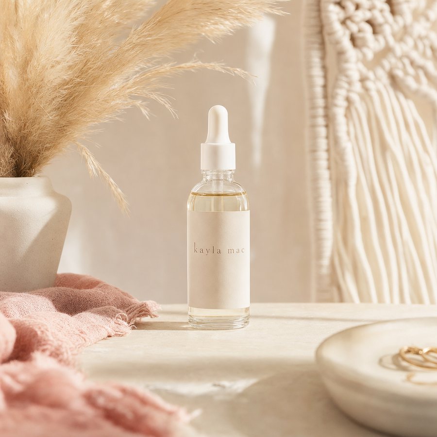 Kayla Mac Scalp + Growth Serum bottle on a cream boho backdrop.
